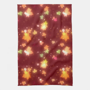 Glowing fall colourful maple leaf brown orange tea towel