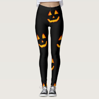 Glowing jack-o-lattern face on black halloween leggings