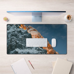 Glowing mountain at sunset desk mat
