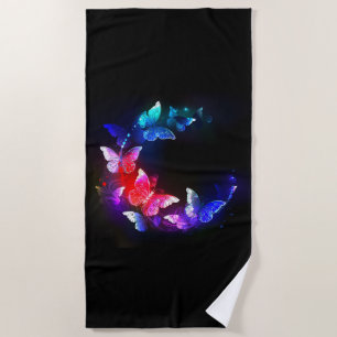 Glowing Neon Night Butterflies on Black background Beach Towel