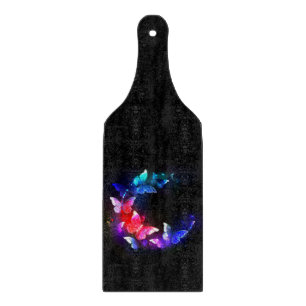 Glowing Neon Night Butterflies on Black background Cutting Board