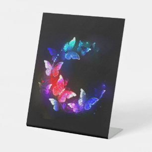 Glowing Neon Night Butterflies on Black background Pedestal Sign