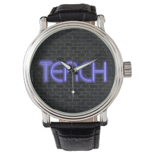 glowing neon TEACH text on brick Watch