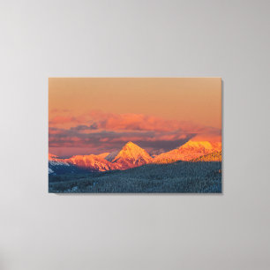 Glowing orange winter mountain range canvas print