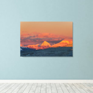 Glowing orange winter mountain range canvas print
