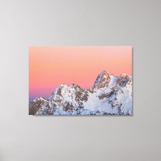 Glowing sunset sky and snowy mountains canvas print (Front)