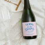 Going to the Chapel Bachelorette Weekend Sparkling Wine Label<br><div class="desc">The Going to the Chapel Bachelorette Collection blends playful charm with classic bridal style. Featuring a soft pink background paired with bold blue typography, this suite captures the excitement of a bride-to-be heading down the aisle. Delicate bow illustrations and a mix of elegant serif and flowing script fonts add a...</div>