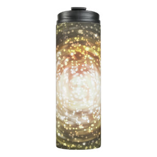 gold abstract blur background, with defocused boke thermal tumbler