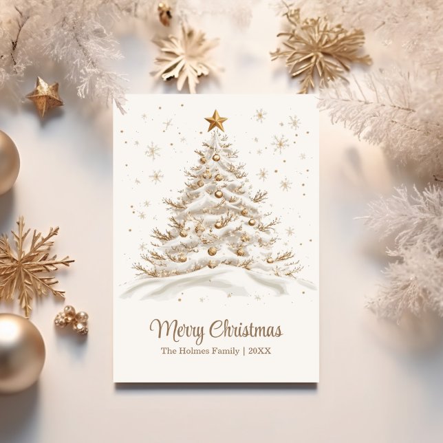 Gold and White Christmas Tree in Snow Holiday Card (Gold and White Christmas Tree in Snow Holiday Card on a white table with golden Christmas ornaments)