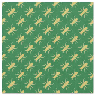 Gold ants on green fabric