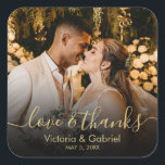 Gold Black Love and Thanks Script Wedding Photo Square Sticker<br><div class="desc">Modern Pretty Chic Black and Gold "Love and Thanks" Script Calligraphy Wedding Thank You | Couple Photo sticker/label for yor gift favour. Featuring an elegant handwritten style calligraphy overlay (on black gradient) with text „Love and Thanks”.</div>