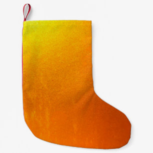 Gold colour or foil on the wall texture background small christmas stocking