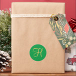 Gold-coloured H on Christmas Green Classic Round Sticker<br><div class="desc">Gold-coloured initial monogram H on Christmas green background.</div>