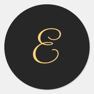 Gold-coloured initial E on black monogram  round Classic Round Sticker
