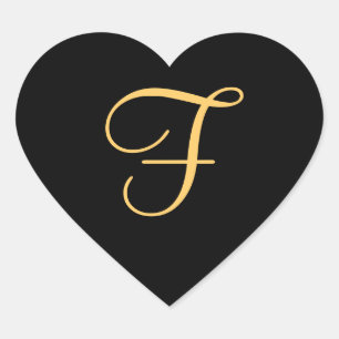 Gold-coloured initial f on black background, heart sticker