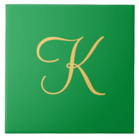 Gold-coloured initial K on solid green background