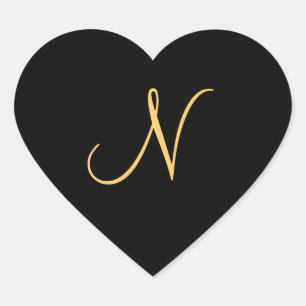 Gold-coloured initial N on black monogram sticker
