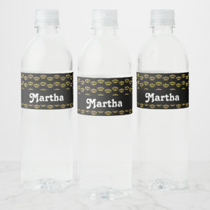 Gold crowns on black water bottle label