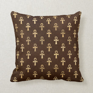 Gold Egyptian Ankh on Brown Cushion