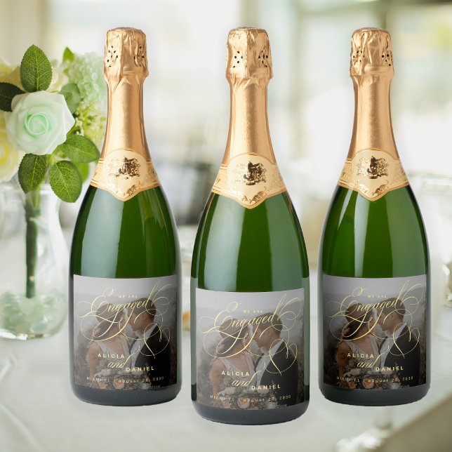 Gold engaged script custom photo engagement party sparkling wine label (Creator Uploaded)