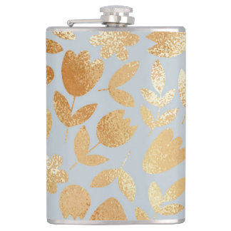 Gold flowers, blue background, foil imitation. hip flask