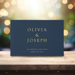 Gold Foil Wedding Custom Navy Blue Guest Book<br><div class="desc">Discover the perfect way to capture heartfelt messages and memories from your wedding guests with this modern elegant gold foil wedding guest book. Personalise with custom names and dates in luxurious gold foil lettering on a stunning Navy Blue background,  ensuring this keepsake will be treasured for years to come.</div>