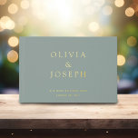 Gold Foil Wedding Custom Sage Green Guest Book<br><div class="desc">Looking for the perfect keepsake from your special day? Our modern elegant gold foil wedding guest book is just what you need. The sage green background creates a serene backdrop for the customisable gold foil lettering, allowing you to capture the names and wedding date in a beautiful memento. This guest...</div>