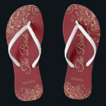 Gold Frills Crimson Red Elegant The Bride Wedding Jandals<br><div class="desc">Dance the night away with these beautiful wedding flip flops. Designed for the bride, they feature a simple yet elegant design with gold coloured script lettering on a crimson red background and fancy golden lace curls and swirls. Beautiful way to stay fancy and appropriate while giving your feet a break...</div>