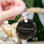 Gold Frills on Black Bridesmaid Wedding Gift Key Ring<br><div class="desc">These keychains are designed to give as favours to bridesmaids in your wedding party. They feature a simple yet elegant design with a classic black background, gold script lettering, and a lacy golden faux foil floral border. The text says "Bridesmaid" with space for her name, the names of the couple,...</div>