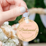 Gold Frills on Coral Peach Bridesmaid Wedding Gift Key Ring<br><div class="desc">These keychains are designed to give as favours to bridesmaids in your wedding party. They feature a simple yet elegant design with a pale coral peach or light orange coloured background, gold script lettering, and a lacy golden faux foil floral border. The text says "Bridesmaid" with space for her name,...</div>