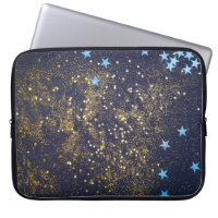 Gold glitter and glittering blue stars on black ba