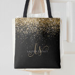 Gold Glitter Glam Monogram Name Tote Bag<br><div class="desc">Glam Gold Glitter Elegant Monogram Tote Bag. Easily personalize this trendy chic tote bag design featuring elegant gold sparkling glitter on a black background. The design features your handwritten script monogram with pretty swirls and your name.</div>