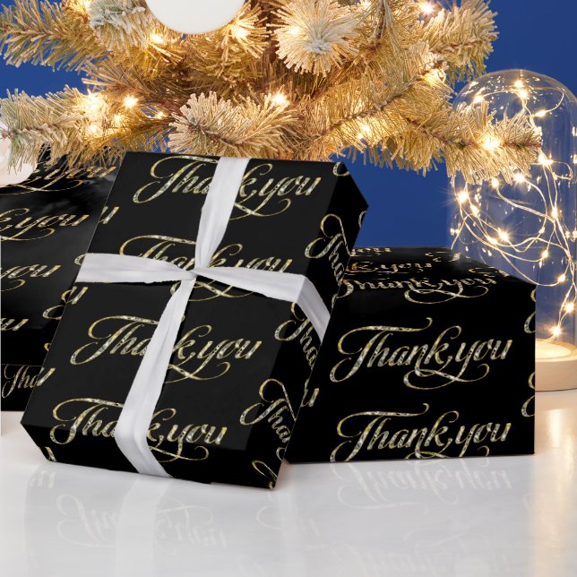 Gold glitter thank you text pattern on black wrapping paper (Holidays)