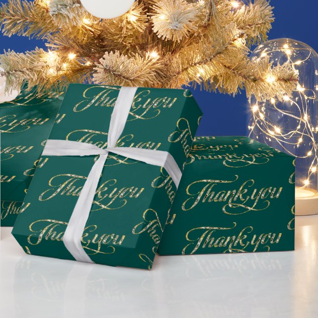 Gold glitter thank you text pattern on turquoise wrapping paper (Holidays)