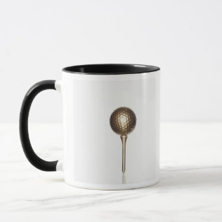 Gold golf ball and tee mug