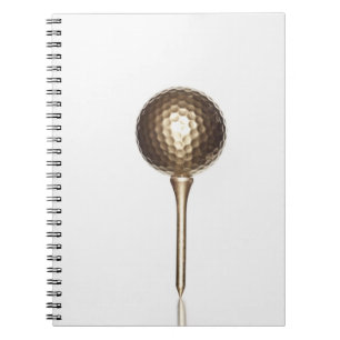 Gold golf ball and tee spiral notebook