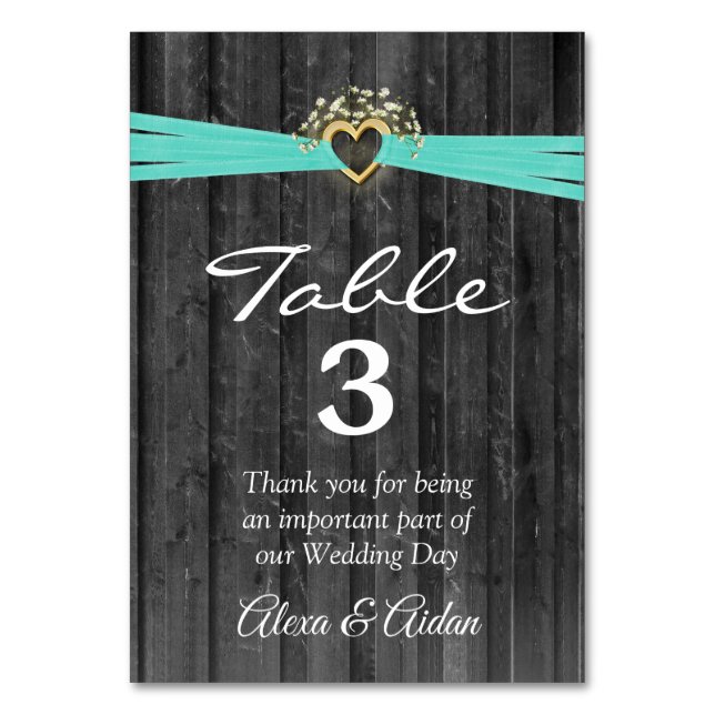 Gold Heart with Turquoise Ribbon On Grey Wood Table Number (Front)