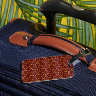 Gold hearts on maroon luggage tag