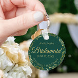 Gold Lace Bridesmaid Wedding Gift Emerald Green Key Ring<br><div class="desc">These keychains are designed to give as favours to bridesmaids in your wedding party. They feature a simple yet elegant design with an emerald green background,  gold lettering,  and a golden faux foil floral lace border. Perfect way to thank your bridesmaids for being a part of your special day!</div>