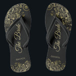Gold Lace on Black The Bride Elegant Wedding Jandals<br><div class="desc">Dance the night away with these beautiful wedding flip flops. Designed for the bride, they feature a simple yet elegant design with gold coloured script lettering on a classic black background and fancy golden lace curls and swirls. Beautiful way to stay fancy and appropriate while giving your feet a break...</div>