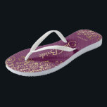 Gold Lace on Cassis Purple The Bride Wedding Jandals<br><div class="desc">Dance the night away with these beautiful wedding flip flops. Designed for the bride, they feature a simple yet elegant design with gold coloured script lettering on a cassis purple, magenta, or berry coloured background and fancy golden lace curls and swirls. Beautiful way to stay fancy and appropriate while giving...</div>