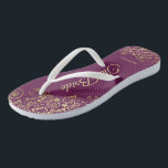 Gold Lace on Cassis Purple The Bride Wedding Jandals<br><div class="desc">Dance the night away with these beautiful wedding flip flops. Designed for the bride, they feature a simple yet elegant design with gold coloured script lettering on a cassis purple, magenta, or berry coloured background and fancy golden lace curls and swirls. Beautiful way to stay fancy and appropriate while giving...</div>