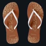Gold Lace on Rust Orange Elegant The Bride Wedding Jandals<br><div class="desc">Dance the night away with these beautiful wedding flip flops. Designed for the bride, they feature a simple yet elegant design with gold coloured script lettering on a rust orange or burnt umber coloured background and fancy golden lace curls and swirls. Beautiful way to stay fancy and appropriate while giving...</div>