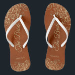 Gold Lace on Rust Orange Elegant The Bride Wedding Jandals<br><div class="desc">Dance the night away with these beautiful wedding flip flops. Designed for the bride, they feature a simple yet elegant design with gold coloured script lettering on a rust orange or burnt umber coloured background and fancy golden lace curls and swirls. Beautiful way to stay fancy and appropriate while giving...</div>