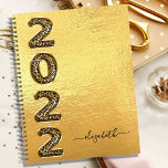 Gold leopard animal pattern monogram 2022 metal planner<br><div class="desc">A stylish faux gold metallic lookint background. Personalise and add a name. Year 2022 is written with large balloon style font with faux gold leopard, animal pattern. The name is written with a modern hand lettered style script with swashes. To keep the swashes only delete the sample name, leave the...</div>