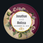 Gold Marble Pattern and Burgundy Florals Wedding Magnet<br><div class="desc">A wedding favour / save the date magnet. Designed with a golden marble pattern and a solid burgundy colour layered diagonally together. A circle with a faux gold foil border which is layered over a pretty floral bouquet with roses, carnations and other flowers. A pair of wedding rings inside the...</div>
