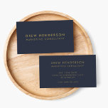 Gold Navy Blue | Minimalist Modern Professional Business Card<br><div class="desc">Simple,  stylish and elegant business card design in modern typography in gold with a clean minimalist design on a navy blue background. The name,  title and contact details can be easily personalised for a unique and professional design statement to enhance your business presence.</div>
