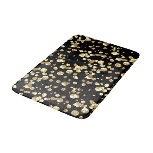 Gold polka dots on a black background . bath mat