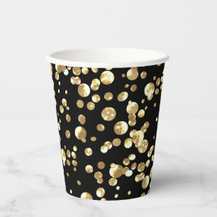 Gold polka dots on a black background . paper plat cups