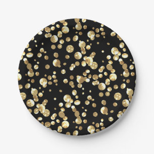 Gold polka dots on a black background . paper plat plate